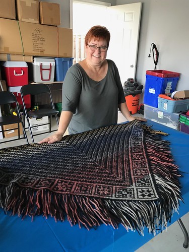 Paulette’s shawl is stunning using Katia Paint with a solid dark colour