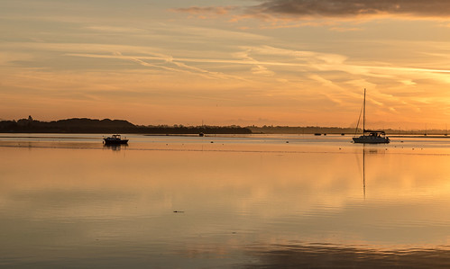 langstone sunrise reflections boats
