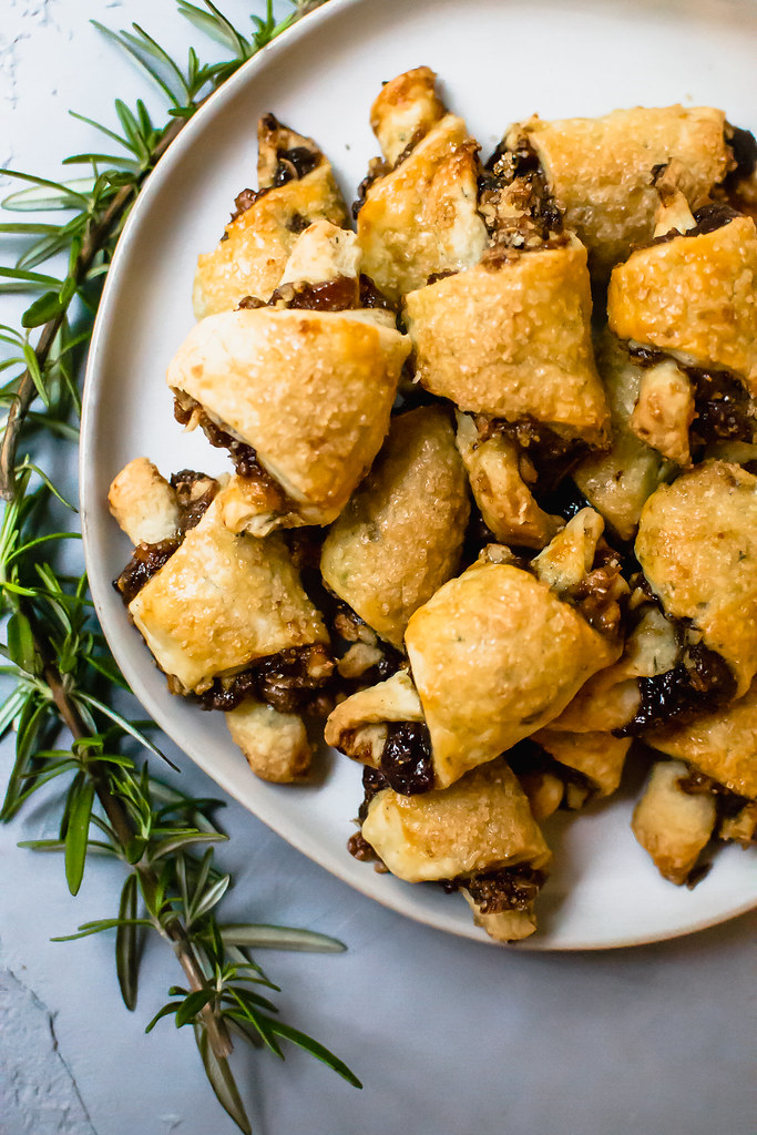 Rosemary and Fig Rugelach is a play on the traditional Jewish cookie, with sweet fig jam, caramelized walnuts and a touch of fresh rosemary for a sweet and slightly savory bite.