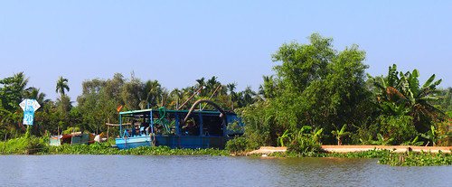 hochiminh city saigon river sky water shore vegetation vietnam