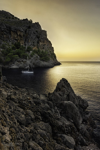sea mediterranean yacht shore rocks torrentdepareis mallorca spain sunset golden evening tranquility water sunlight nature landscape travel europe island