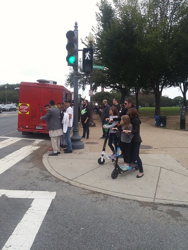 Adult e-scooter users carrying children in the vicinity of the National Mall