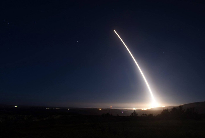 A missile is launched into the night sky.