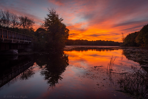 concord michigan unitedstates us sky red morning sunrise water lake reflection pond orange trees bridge fall autumn colors nikon d7200