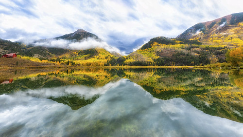 aspen colorado co fall autumn colors rainy weather clouds cloudy marble lake beaverlake reflection reflections mirror calm still smooth water mountains trees leaves sky blue red gold picturesque landscape pano panorama natureinfocusgroup