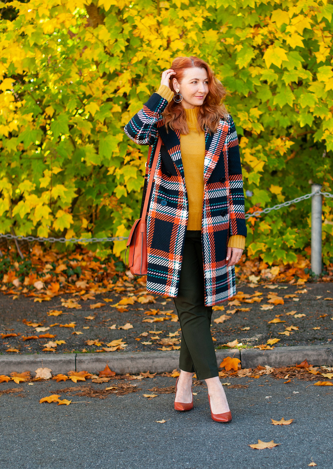 Dressing in Bold, Saturated Autumnal Colours \ check statement coat \ bottle green trousers \ burnt orange heels \ burnt orange suede messenger bag \ mustard yellow sweater | Not Dressed As Lamb, over 40 style