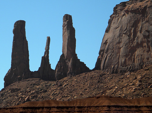 Dark pinnacles of rock at Monument Valley, within the Navajo Nation land that straddles the Arizona-Utah border