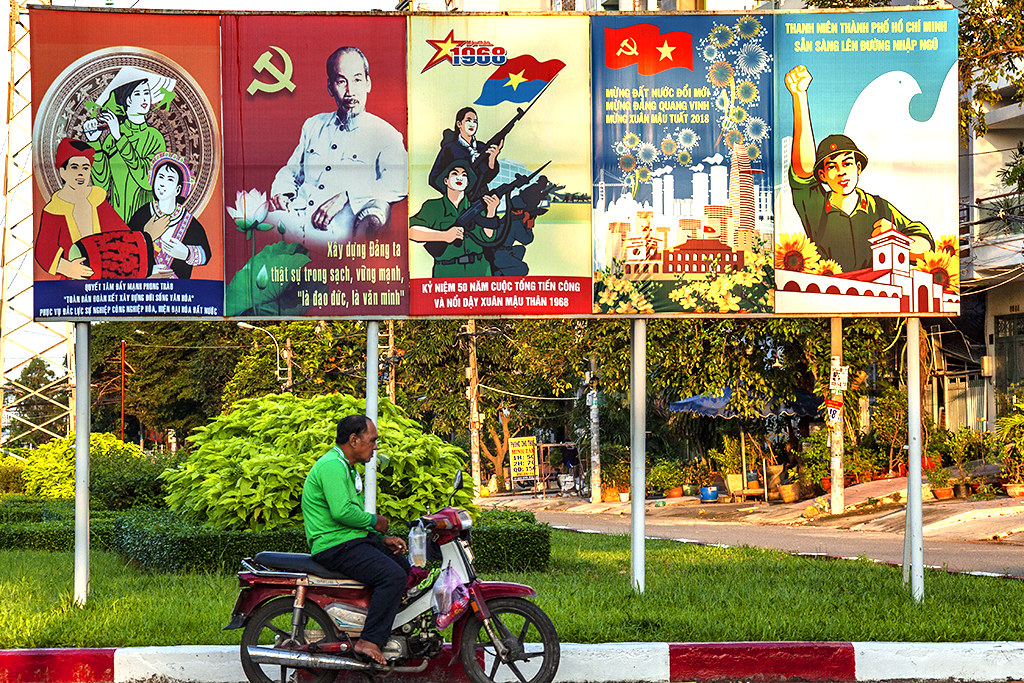 Propaganda posters on Vanh Dai--Saigon