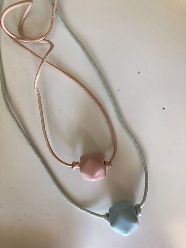 Making a simple ceramic bread necklace with waxed cotton cord. EvinOK.com